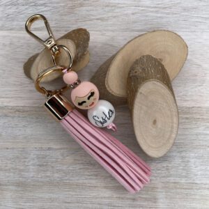 Sleutelhanger popje van geluk roze - sister met kwast