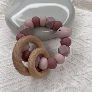 Bijtring vogel oud roze